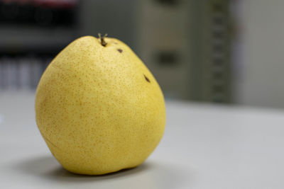 Close-up of lemon on table