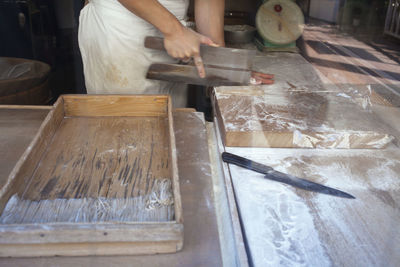 Man working on cutting board