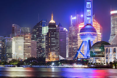 Illuminated buildings in city at night