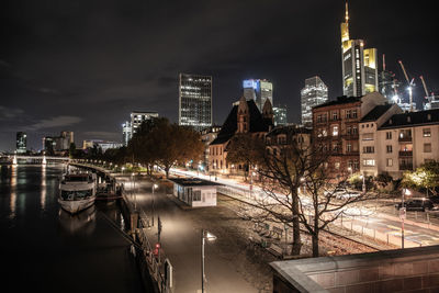 Illuminated buildings in city at night