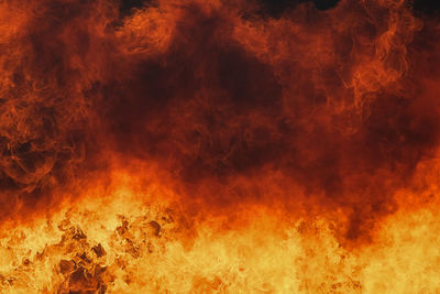 Abstract image of fire against orange sky