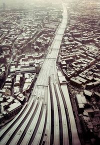 High angle view of railroad tracks by street in city