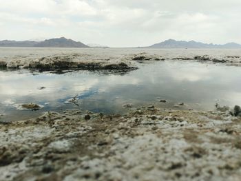 Scenic view of sea against cloudy sky