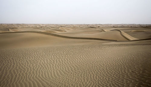 Scenic view of desert against clear sky