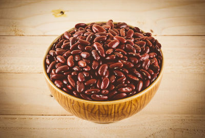 High angle view of coffee beans in glass on table