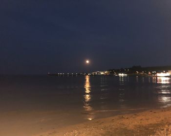 Scenic view of sea against sky at night
