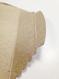 High angle view of paper over white background