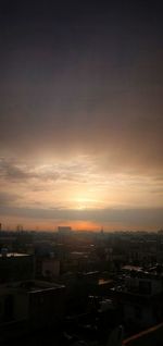 High angle view of buildings against sky at sunset