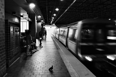 Blurred motion of train at railroad station