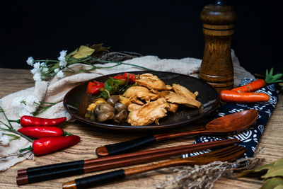 Close-up of food on table against black background