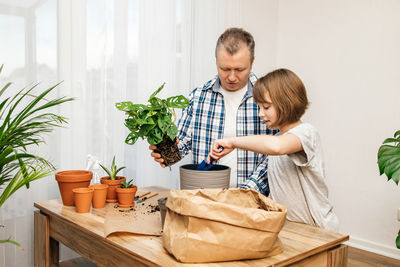 Portrait of smiling young woman working at home