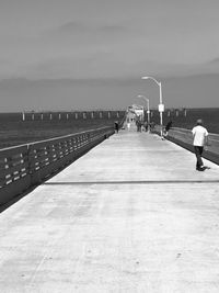 People on beach against sky