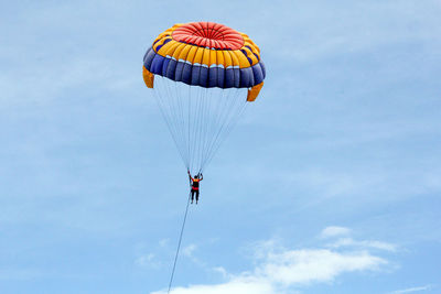 Low angle view of kite flying against sky