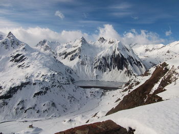 Scenic view of snowcapped mountains against sky