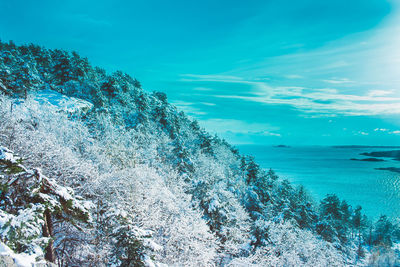 Scenic view of sea against sky during winter