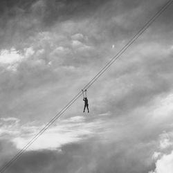 Low angle view of silhouette man against sky