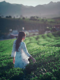 Woman standing on field