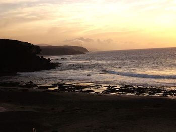 Scenic view of sea against sky during sunset