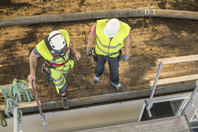 High angle view of manual workers at construction site