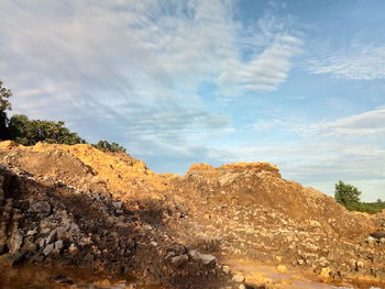 Low angle view of rock formation against sky