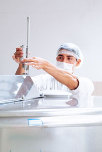 Portrait of man working on table