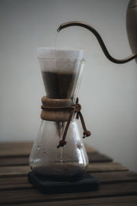 Close-up of coffee in glass on table