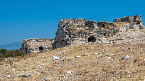 Old ruins against clear blue sky