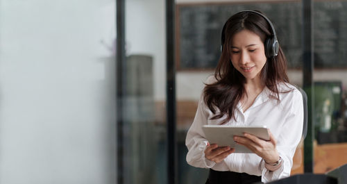 Young woman using mobile phone