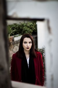 Portrait of young woman standing 