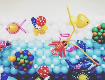 Close-up of colorful balloons on white background