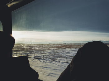 Silhouette of person on snow covered landscape