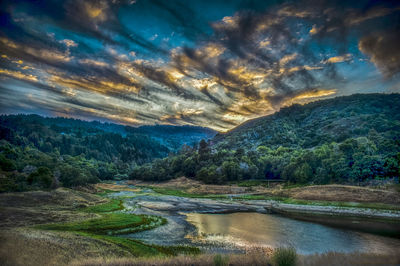 Scenic view of river and mountains