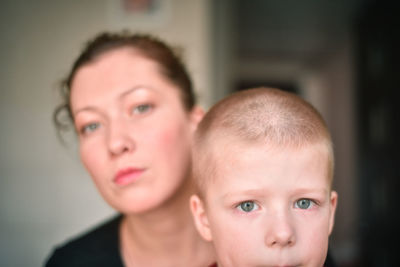 Portrait of mother with boy sitting outdoors