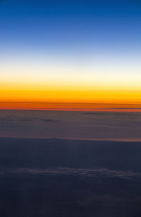 Scenic view of sea against sky at sunset