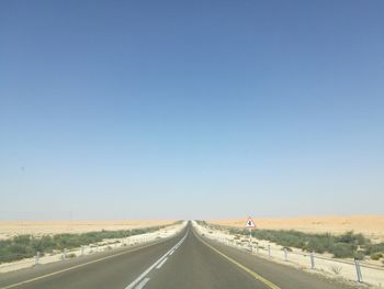 Road against clear sky