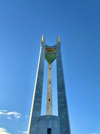 Low angle view of monument against blue sky