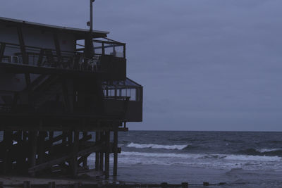 Building on beach against sky