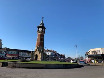 View of buildings against blue sky