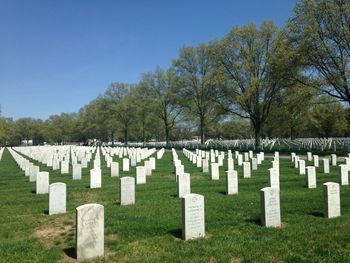 Tombstones at long island national cemetery against sky