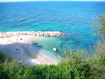 High angle view of sea shore against sky