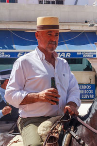 Full length of a man holding boat