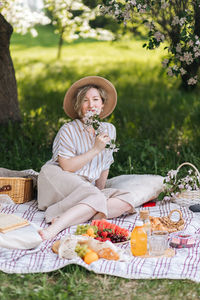 Portrait of smiling young woman sitting in tent