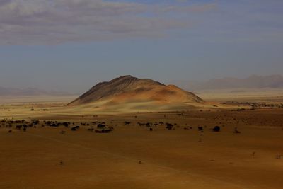 Scenic view of desert landscape against sky