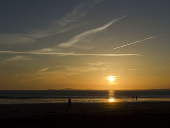 Scenic view of sea against orange sky