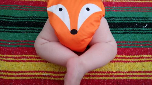 Low section of person on bed