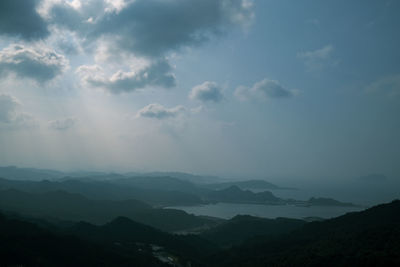 Scenic view of silhouette mountains against sky