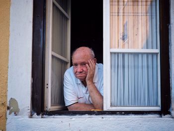 Man standing by window