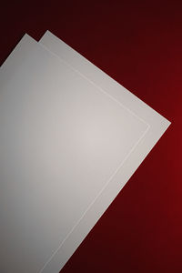 High angle view of paper on table against wall