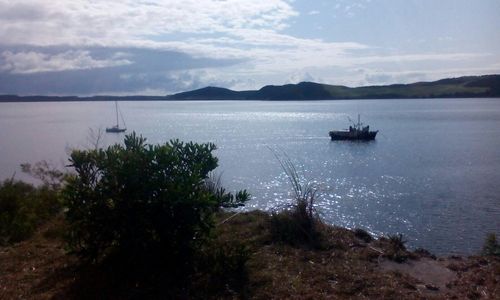 Scenic view of sea against cloudy sky