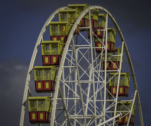 Low angle view of ferris wheel against sky